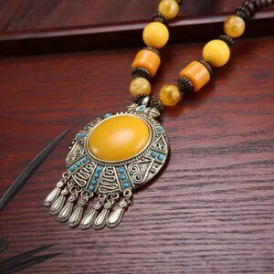 Vintage retro necklace with blue stone leaf tassels. Ethnic Tibetan jewelry.